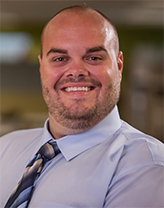 A man wearing a tie and collared shirt