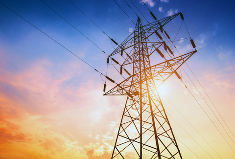 Transmission tower against a colorful sunset