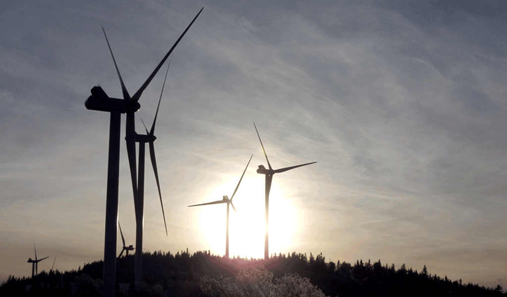 Windmills at sunset at the Kingdom Community Wind facility.