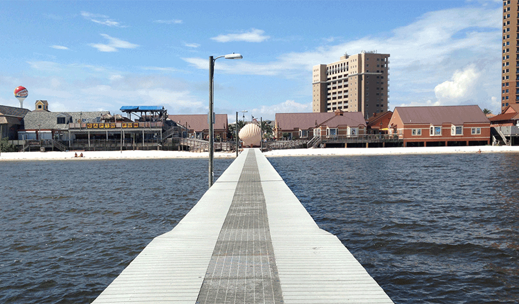 A pier stretches into the water at Gulf Islands National Seashore.