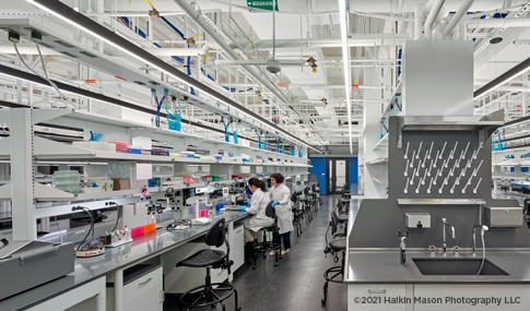 Children’s National lab with microscopes and technicians running tests. 