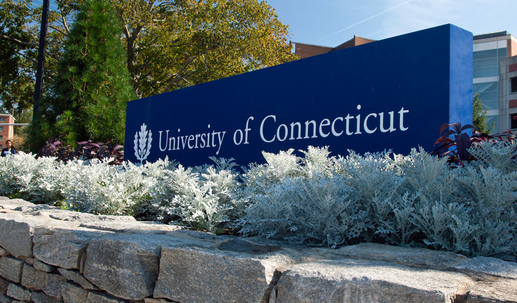 Blue entrance sign to the University of Connecticut.