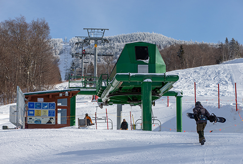 Bolton Valley ski lift and snowboarder.