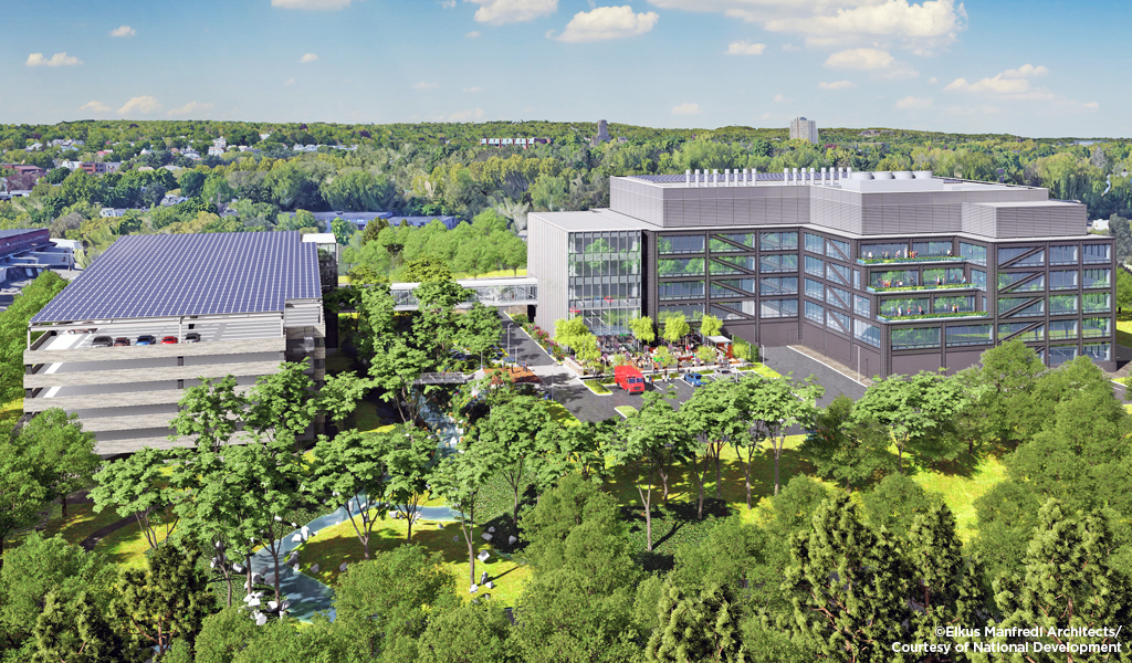 Oblique aerial rendering of the exploratory lab building with adjacent parking lot and parking garage. 