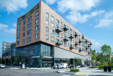 A 4-story residential building with Stop & Shop on the ground floor in Allston, MA.
