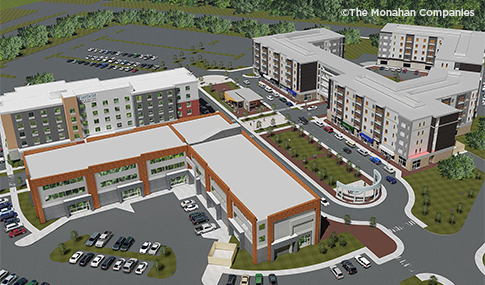 Aerial view of multiple building surrounding a courtyard with a fountain at Merrimack Park Place.