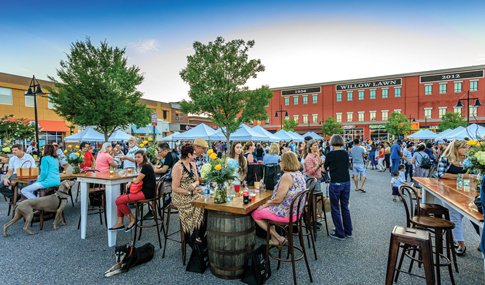 People sit outside to dine at Willow Lawn in Richmond, VA