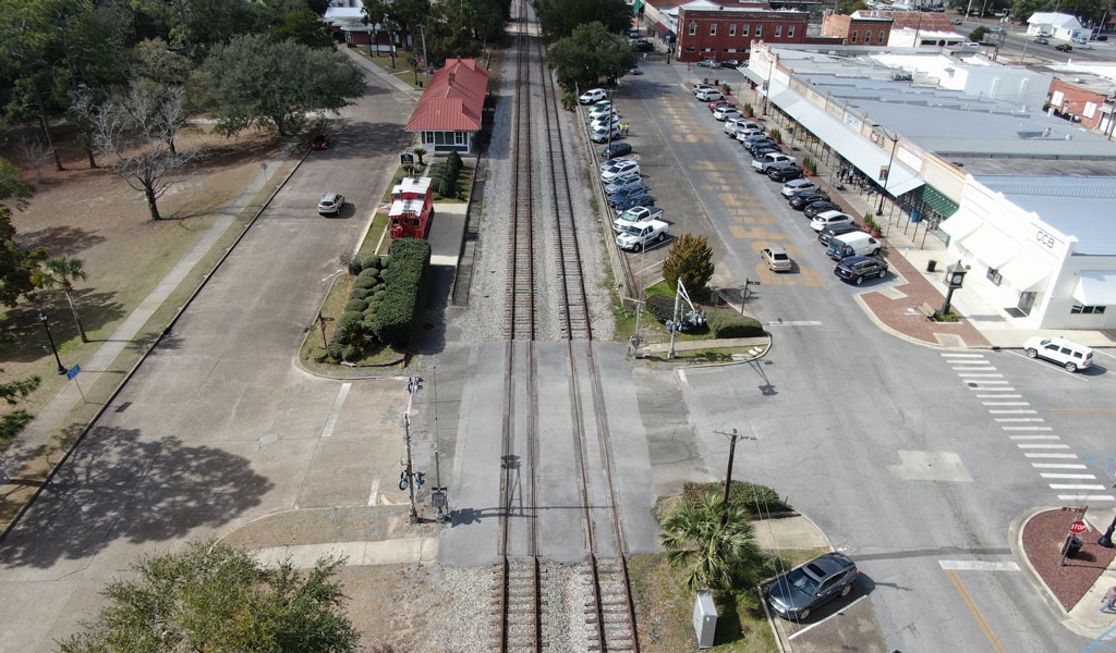 A train track through a rural city.