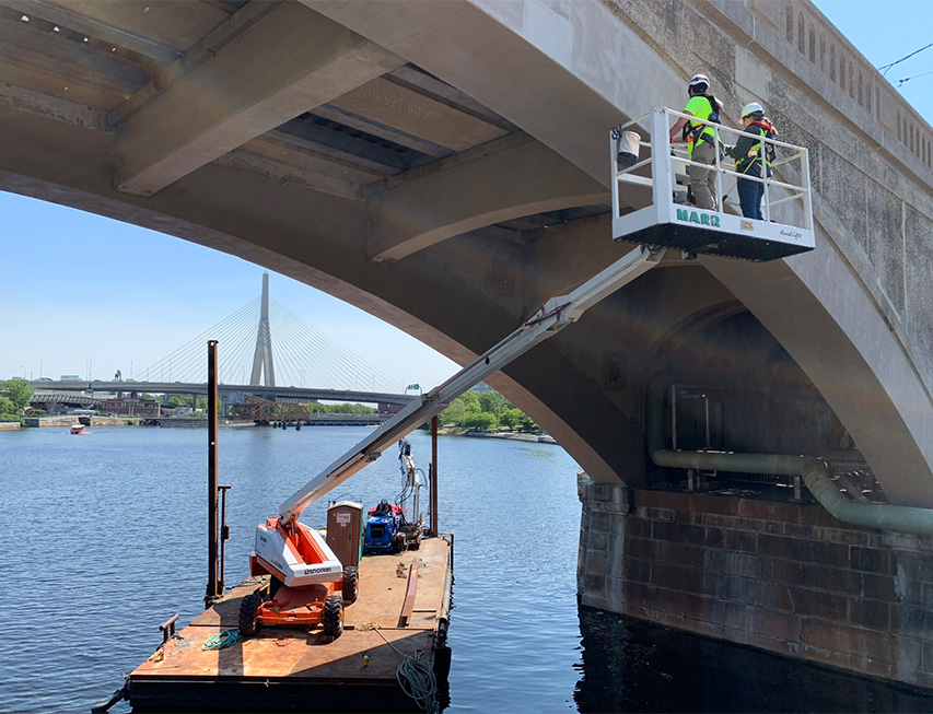 Bridge Inspectors inspecting bridge over water