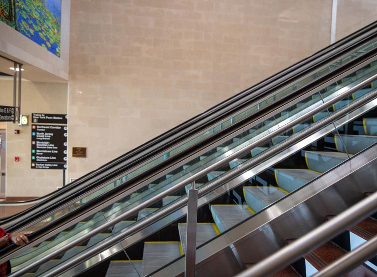 A close-up of an escalator.