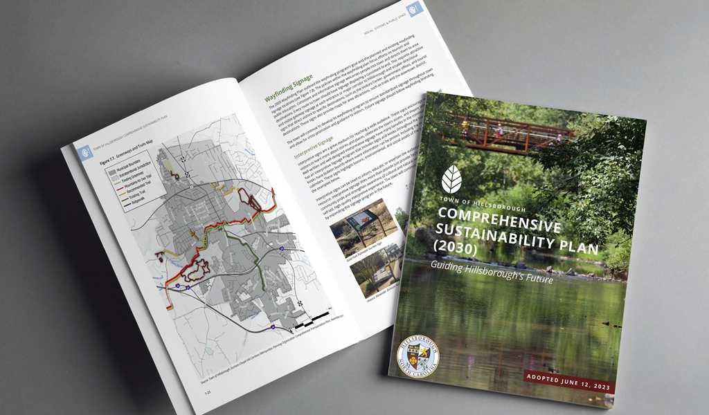 The Hillsborough Sustainability Plan front cover and opened book showing a map of the study area. 