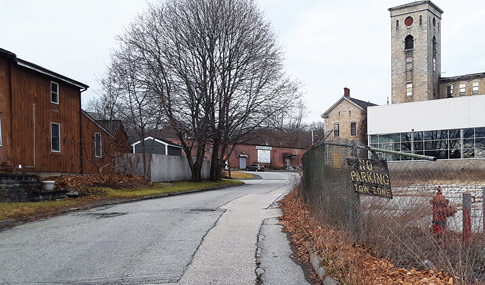 Stevens Mill’s dilapidated parking lot and chain-link fence.