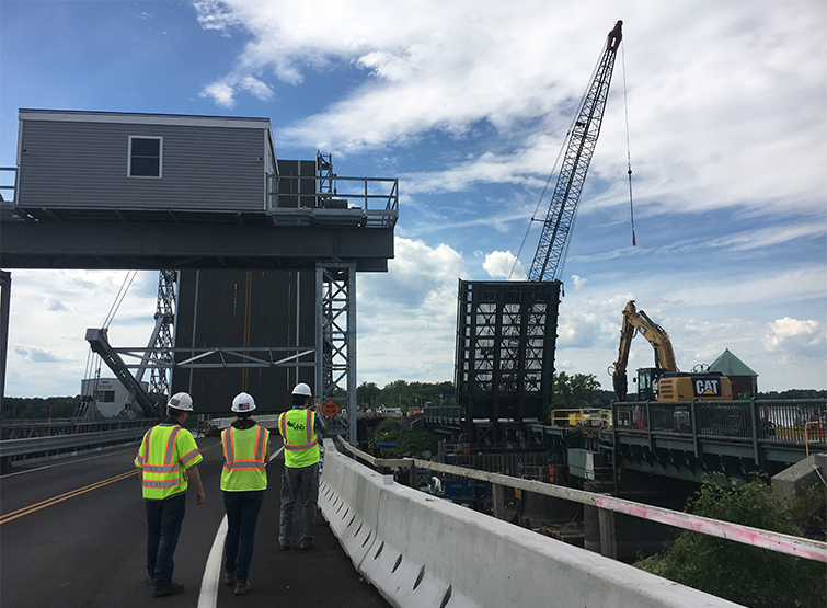 Construction workers overseeing bridge project.