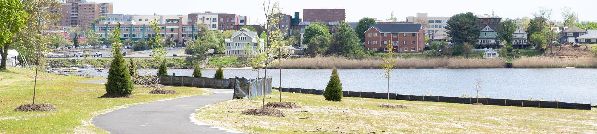 A walking trail and boat ramp at Swimming River Park.