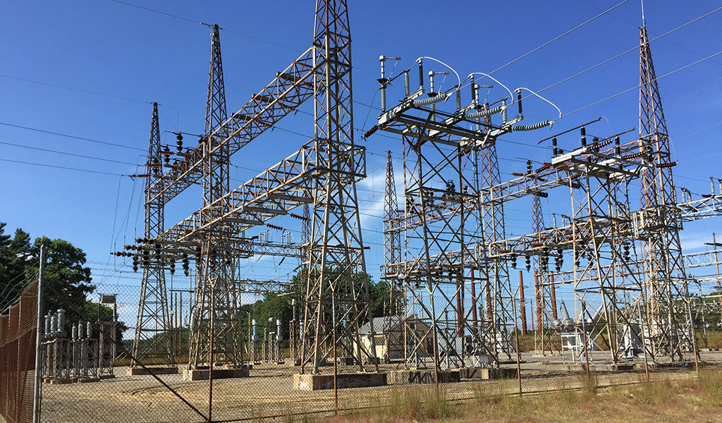 Kingston Substation with electrical equipment and power lines on a clear day.