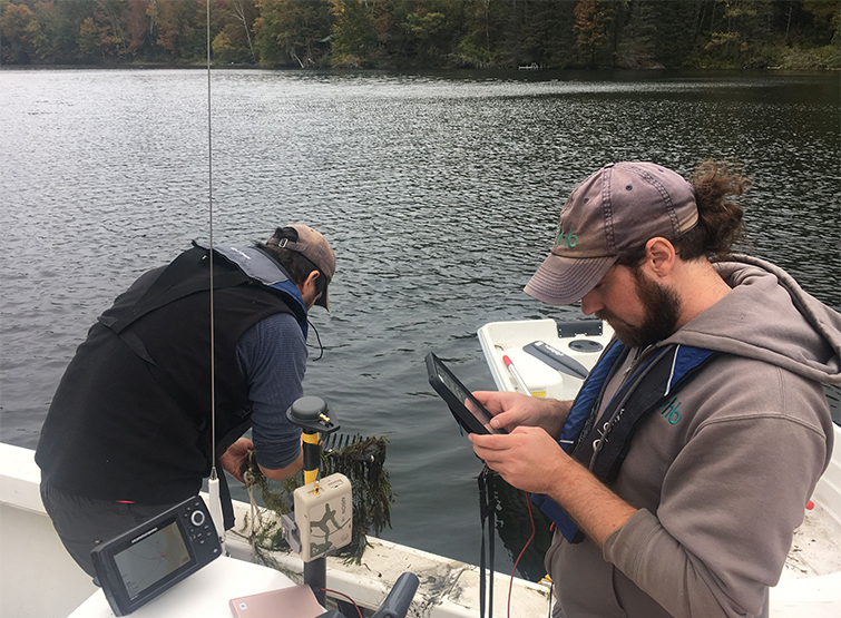  VHB staff conducting surface water sampling.