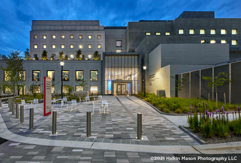 A view of the front entry of Children’s National Research Institute at dusk. 