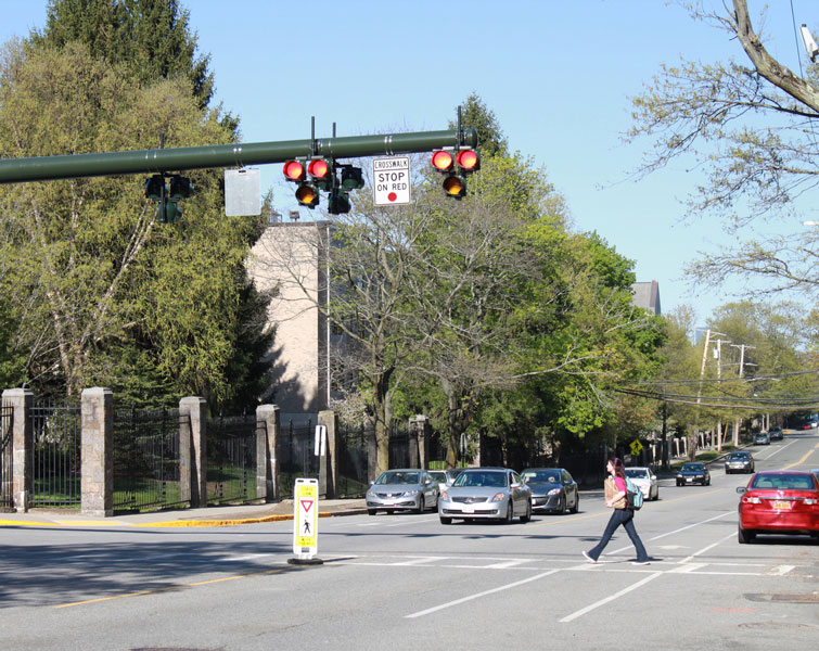 A pedestrian uses a high-intensity activated crosswalk. 