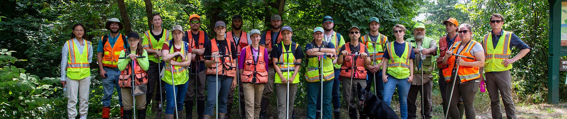 VHB team members wear safety vests while supporting a neighborhood clean-up.