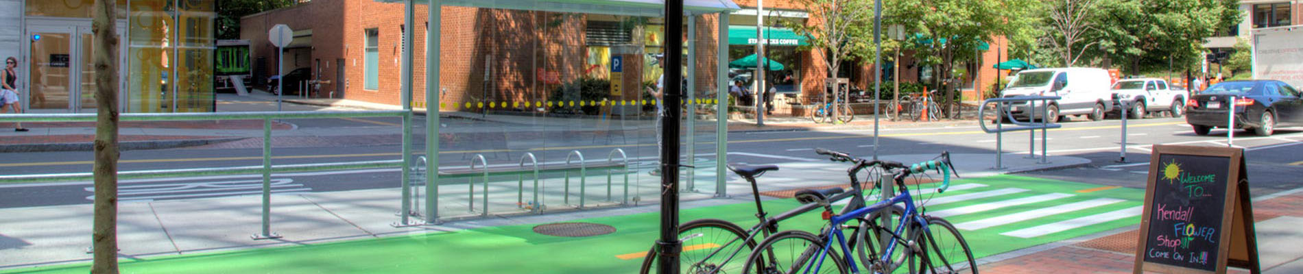 A city street featuring multimodal transportation access, including dedicated bus and bike lanes.