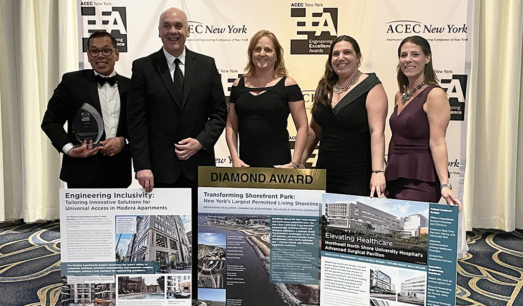 VHB employees posing with award-winning projects.