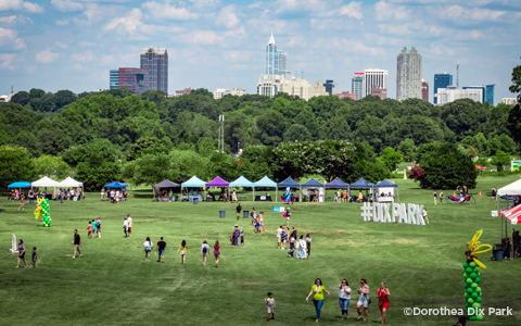 SunFest Festival at Dix Park with the Raleigh Skyline in the distance