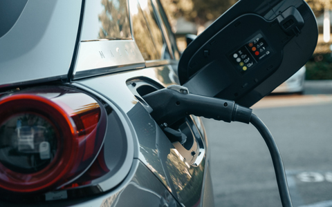 Stock image of electric vehicle charging. 