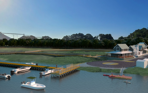 View of the existing parking lot, small dock, and pump station on site from Hoskins Creek.