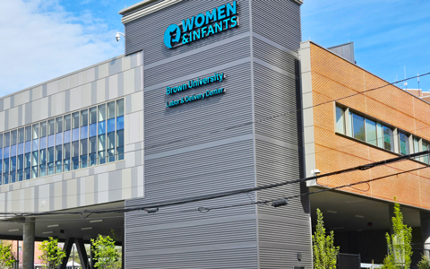 Glass and brick building with Women and Infants sign.