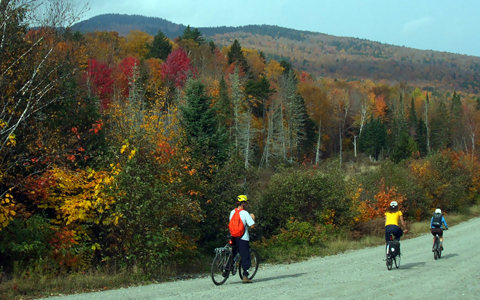 Bicyclists on gravel bike paths in Bethel, Maine.