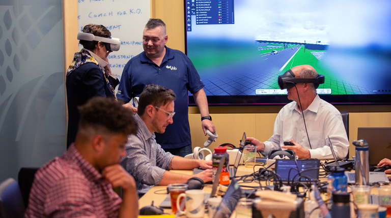 VHBers wearing virtual reality headsets testing the Model-Based Design programs.