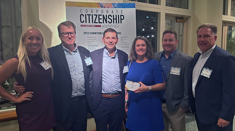 Tom Jackmin, Mark Junghans, Kathleen Keen, Brianne Belschner, Rob Nagi, and Matt Kealey accept a Boston Business Journal award.