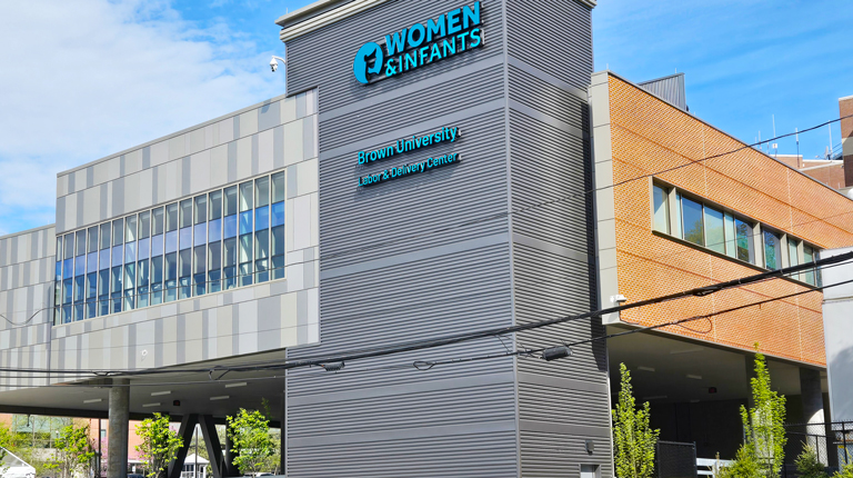 Glass and brick building with Women and Infants sign.