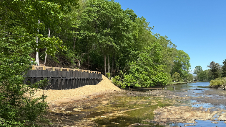 Newly constructed road next to waterfront. 