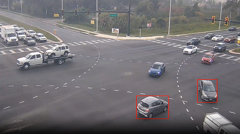 An aerial view of a near-miss detected within a roadway intersection.