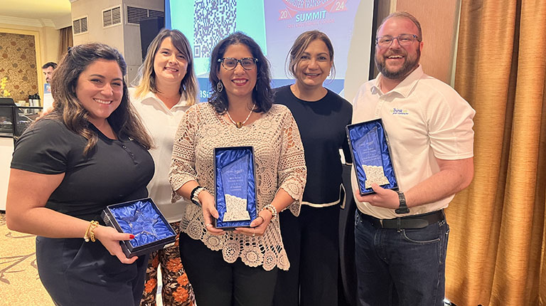 The VHB reTHINK Your Commute team members pose with their awards  