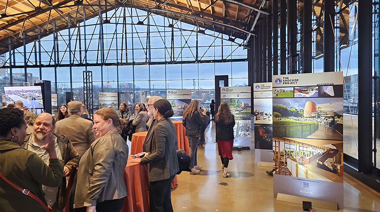 Attendees gather at the Shockoe Project master plan reveal event to the public