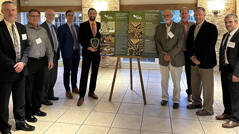 Joe Balskus, VHB Director of Transportation Systems, accepts ACE award with the project team