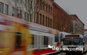 Streetcar and bus on urban street