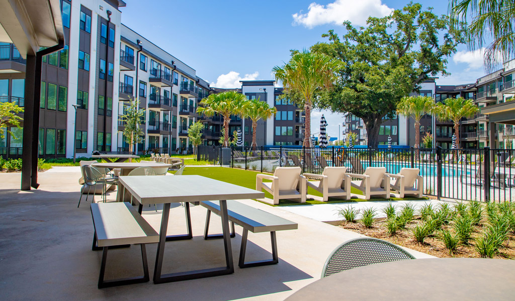 Outside the pool area of a modern apartment building.