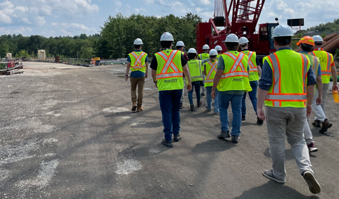 The group of Southeastern New England ITE visitors and VHB and Barletta staff gathered together at the project site.