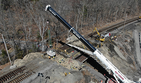 A construction crane over a bridge