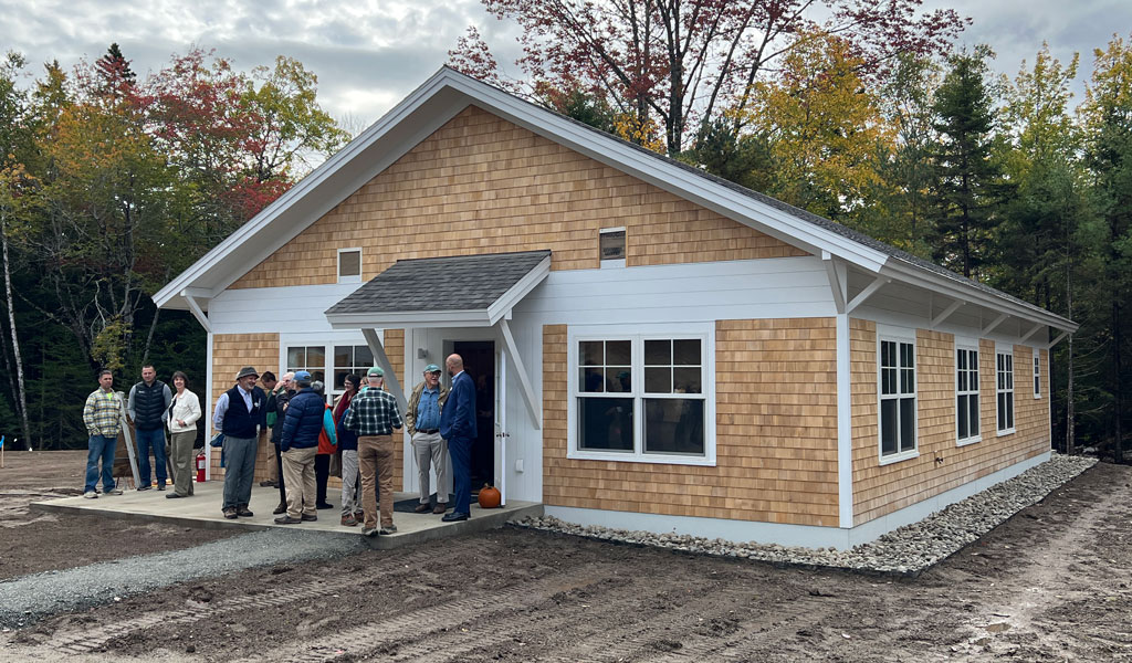 People outside of a new building.