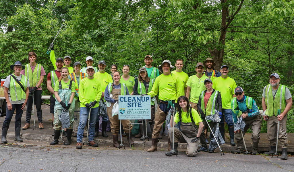 VHB employees smiling in a group in a cemetery.