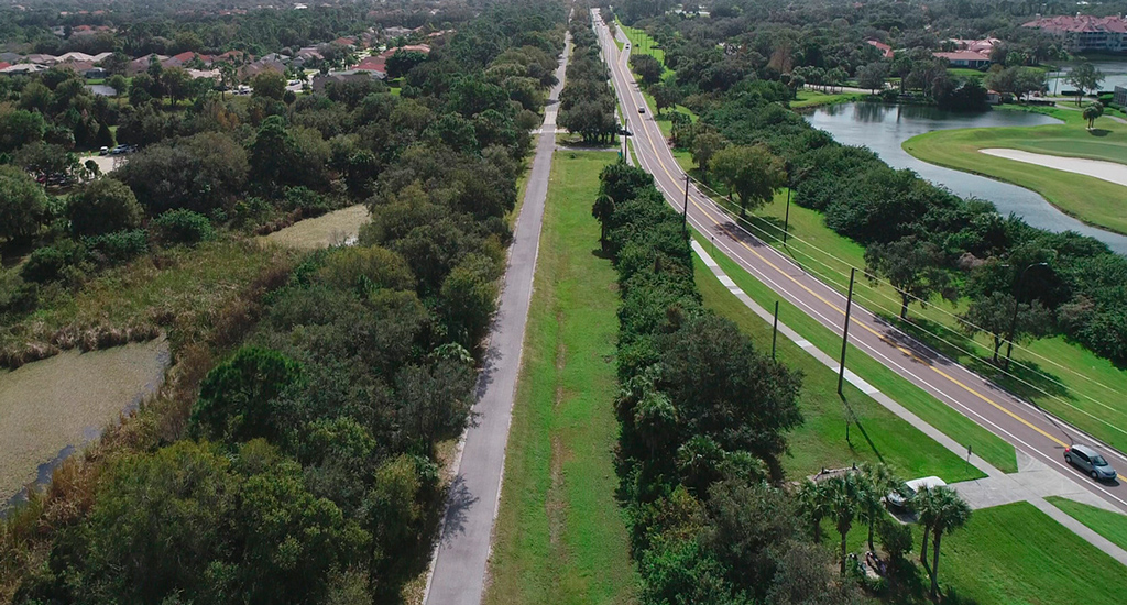 Aerial view of Legacy Trail alongside McIntosh Road in Florida. 