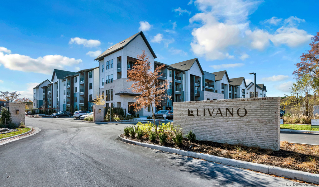 The Livano Apartments vehicle entrance and entrance sign.
