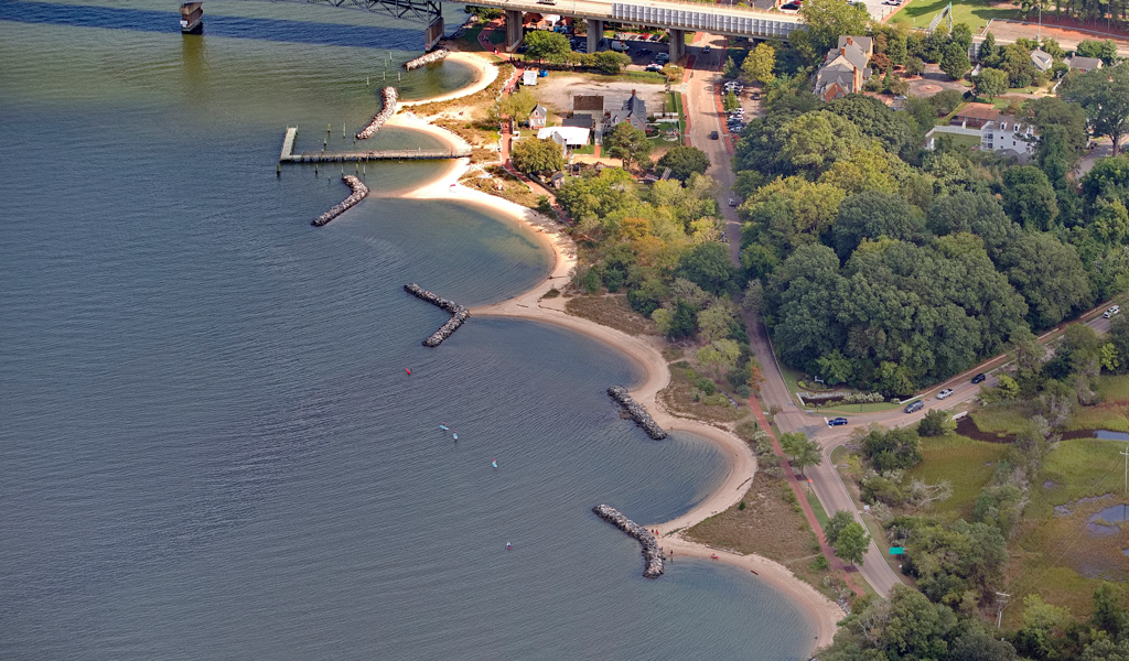 An aerial view of Yorktown in 2024 after the revitalization efforts that showcase the breakwater system and living shorelines.