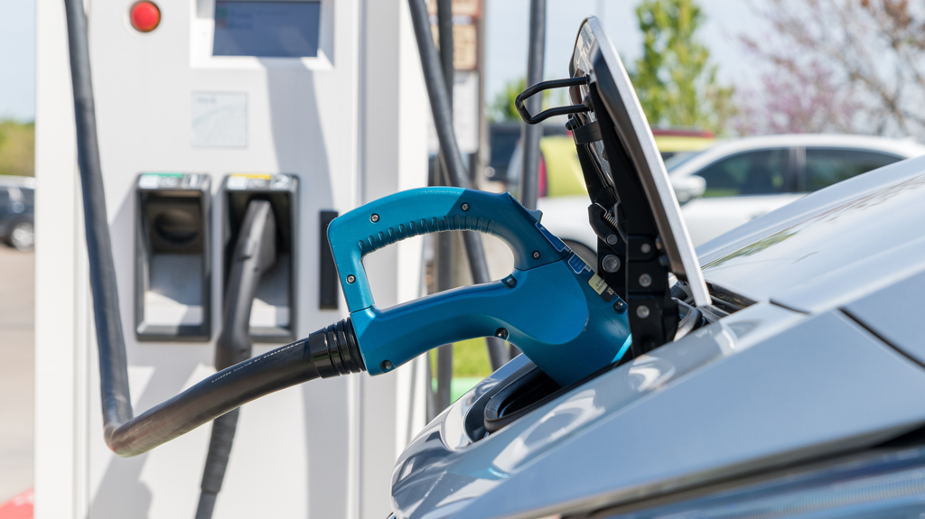 A car receiving a charge at an EV charging station. 