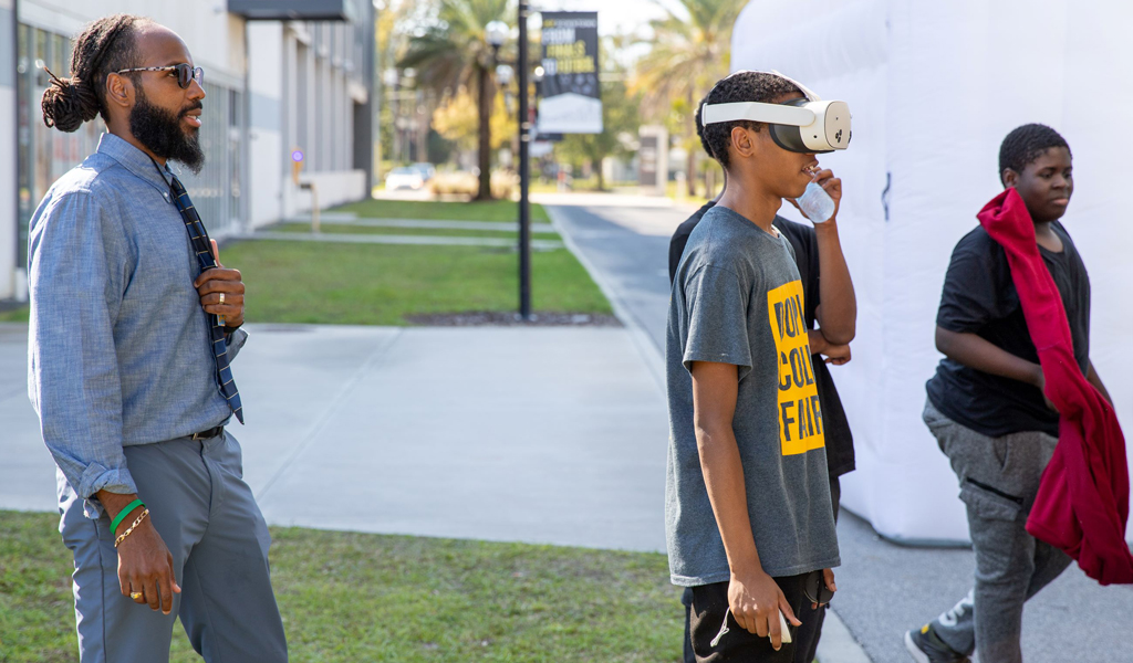 Youth learn about sustainability from City of Orlando at the mobile REACH Hub.