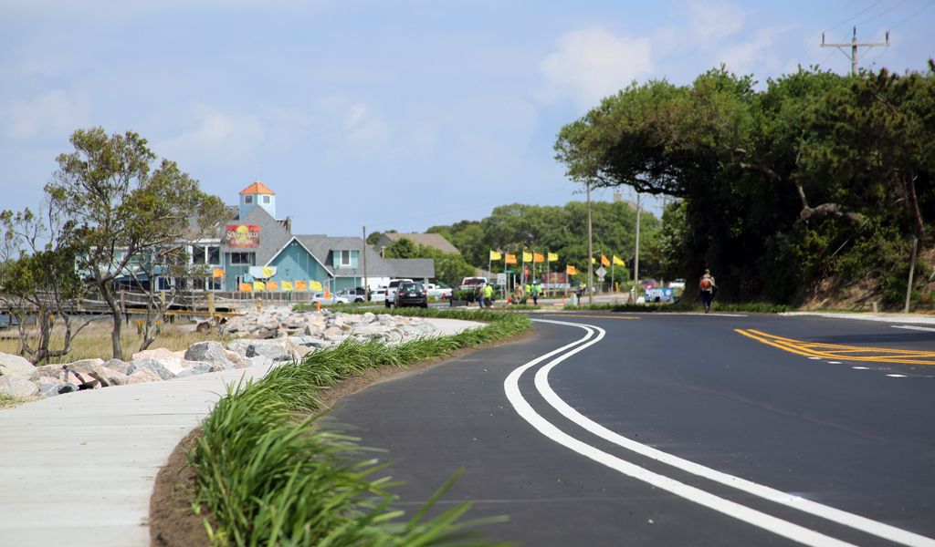 The new roadway, sidewalk improvements, and living shoreline at the end of construction.